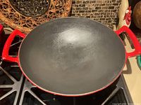 Interior view of red wok on stove