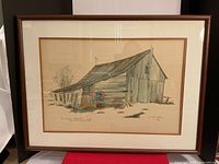 Framed watercolour painting of barn with glass cover showing intact frame and full artwork.