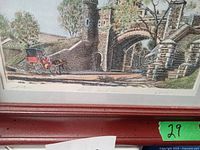 Close-up of the painting showing detailed stone architecture and horse-drawn carriage in Quebec cityscape with a green sticker marked '29'.