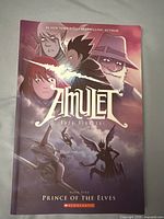Front cover of the book showing artwork and title "Amulet Book Five: Prince of the Elves"