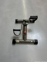 Top view of the Stamina InStride Folding Cycle XL showing pedal on the right side with adjustable strap and central tension knob