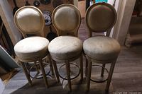 Front view of three matching bar chairs