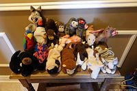 Full view of all Beanie Babies arranged on bench