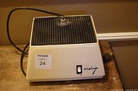 Front view of Wizling stained glass grinder showing work surface, switch, logo, cord