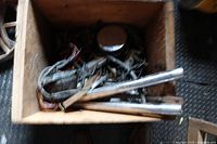 Wooden box containing wiring harness, chrome round cover, two fork tubes and assorted parts