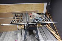 Full view of Craftsman table saw with stand, extension wings and accessories on tabletop