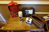 Overall lot showing Axe Phoenix kit, Nivea shaving foam, Nivea balm box, red boxed toiletry set, brown dopp kit