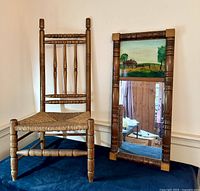 Spindle-back Brewster chair next to trumeau mirror showing overall condition and design.