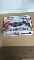 Original box of Atari Flashback 6 with graphics and game list.