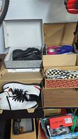 Overview of four pairs of sneakers in boxes