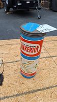 Original Tinkertoy cylindrical container with label visible on outside.