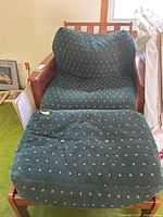 Front view of the futon chair with back and seat cushions, plus matching bench with cushion in front.