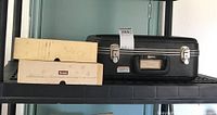 Photo of Kodak Carousel 750 slide projector case and boxes of carousel trays