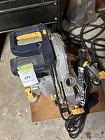 Front angle view showing the handle, blade guard, and attached dust collection bag with Mastercraft branding.