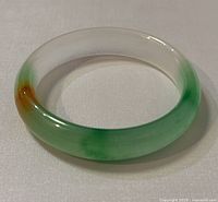 Top-down view showing the shape and color gradient including white, green and orange sections.