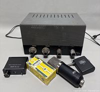 Front and side view of BOGEN K10 Series F-87 tube amplifier head with included microphone, audio converter, and wireless audio receiver. Minor wear visible on amplifier casing.