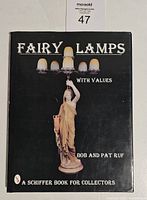 The front cover of the hardcover book 'Fairy Lamps with Values' showing the title, authors Bob and Pat Ruf, and a large classical statue holding fairy lamps.