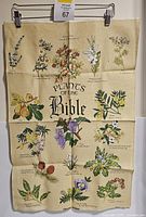 Full view of beige linen showing multiple colored botanical illustration and scripture references titled 'Plants of the Bible'.