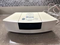 Front angle view of Bose Wave Music System showing its sleek design and center black panel.