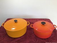 Overview of both Dutch ovens side by side on table