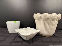 All three white ceramic planters grouped together