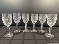 Front view of six Galway crystal goblets aligned