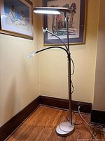 Full view of OttLite standing craft lamp showing lamp head, magnifier and clamp attachments