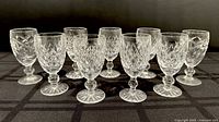 Nine Waterford crystal sherry glasses grouped