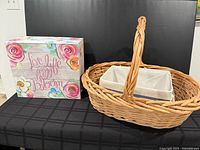 wicker basket and floral cardboard box front view