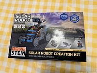 Front of unopened Solar Robot Creation Kit box showing a robot image and text about 5 different robots and solar power.