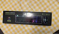 Box view of KM930 luminous keyboard and mouse combo showing full box graphics and product image
