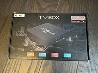 Front of the box showing MXQ Android TV Box image and key features: CPU 864M, 4-core processor, 4K UHD support.