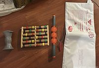 Various massage rollers including wooden bead roller, spiked rollers, and metal wire head massager plus a white bed-wetting sensor pad with wires.
