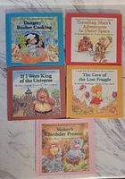 Five Fraggle Rock hardcover books with front covers visible. Titles and colorful illustrations of characters shown.