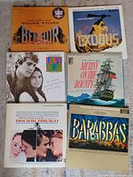 Photo showing 7 vinyl record covers: Ben Hur, Exodus, Love Story, Mutiny on the Bounty, Doctor Zhivago, Barabbas.