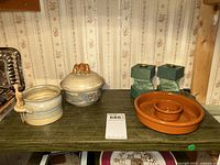 Full view of the lot items including pottery dishes, candle holders, and chip and dip plate.