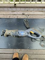 Side view of the Mastercraft reciprocating saw showing ergonomic handle, trigger, and power cord.
