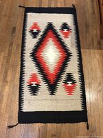 Full view of front side showing central diamond motif and overall pattern