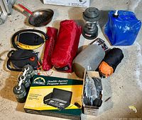 Overview of all camping items arranged on floor