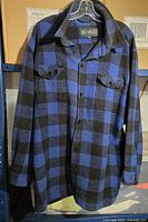 Front view of XXL blue and black checkered flannel shirt by Big Valley showing front button closure and chest pockets.