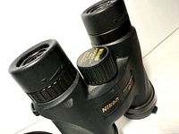 Angled top view of Nikon Monarch M511 8x42 binoculars showing focus knob and eyepieces