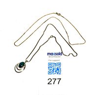 Both necklaces laid flat showing overall length and shape, gold serpentine chain and silver box chain with pendant.