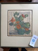 Frontal view of framed woodcut print showing full artwork, matte and frame