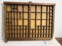 Full view of the wooden printer's/typesetter's drawer with many compartments visible