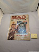 Alternate view of MAD Magazine issue #60 congratulating Richard Nixon on his election, showing minor cover wear details.