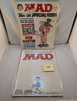 Front view of two Mad magazines Super Special Number Twenty from the 1970s, one sealed and one unwrapped, showing Don Martin cartoon cover art.