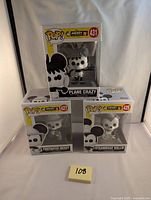 Front view of the three boxed Funko Pop figures featuring Plane Crazy Mickey (#431), Firefighter Mickey (#427), and Steamboat Willie (#425) with clear plastic window display.