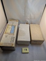 Three sealed cardboard boxes holding the hockey card collections