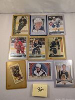 Photo of 9 modern hockey cards featuring various players in different team jerseys and card styles.