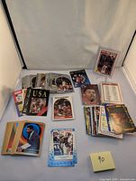 Various vintage NBA basketball trading cards spread out including multiple sets and years, some cards have USA Basketball and All-Star themes.